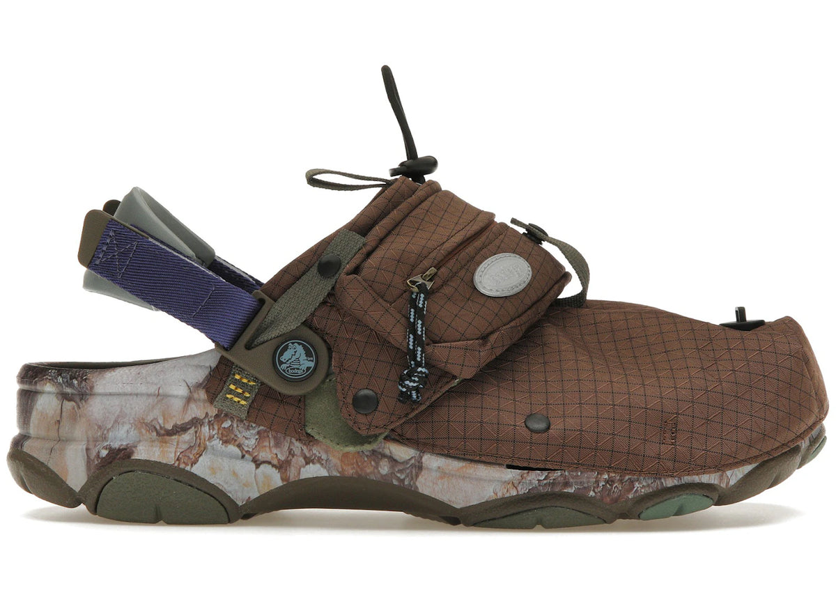 https://images.stockx.com/images/Crocs-Classic-All-Terrain-Clog-20-NICT-TECH-Bodega-Off-the-Beaten-Path-Product.jpg?fit=fill&bg=FFFFFF&w=700&h=500&fm=webp&auto=compress&q=90&dpr=2&trim=color&updated_at=1738193358