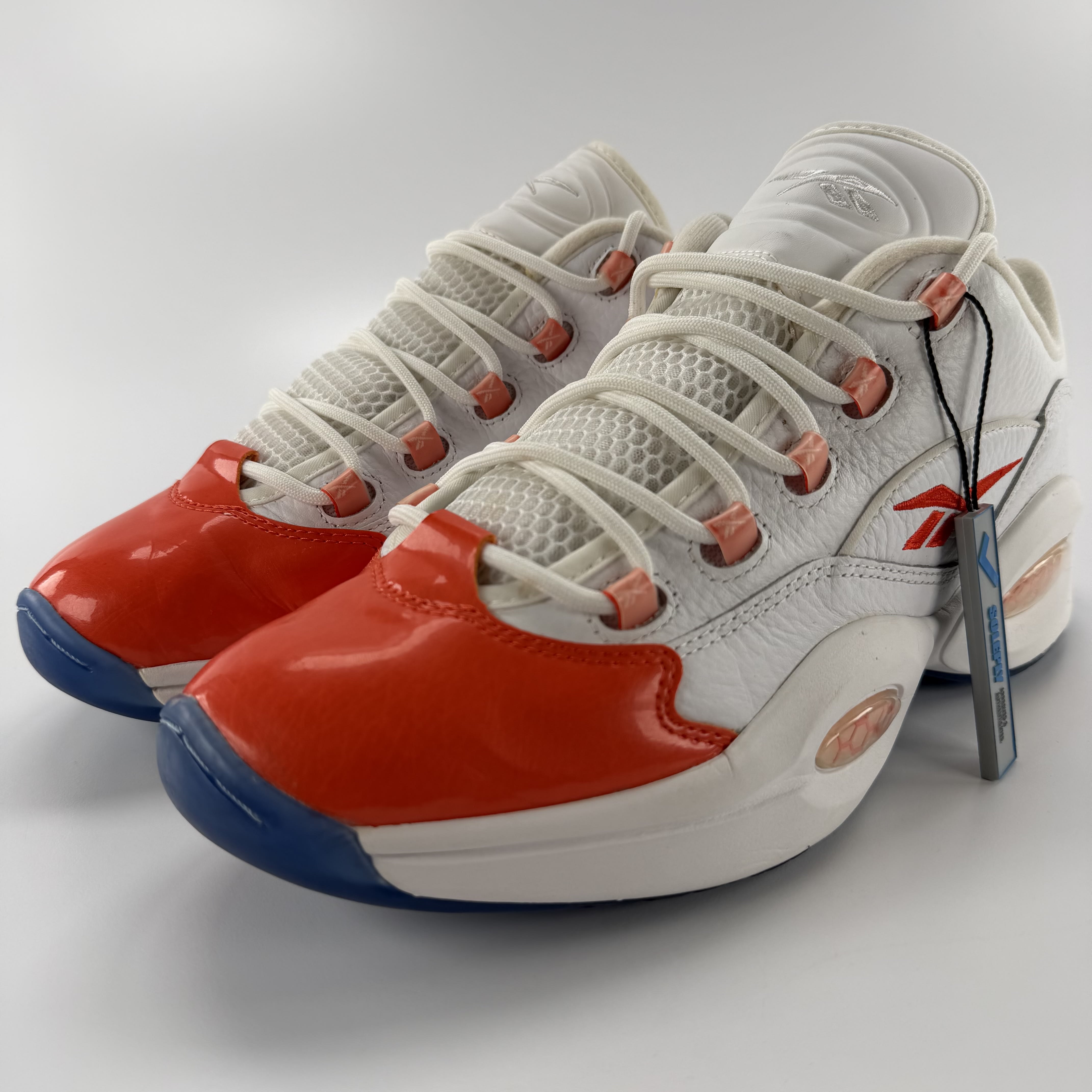 590668 Reebok Question Low Patent Toe Orange
