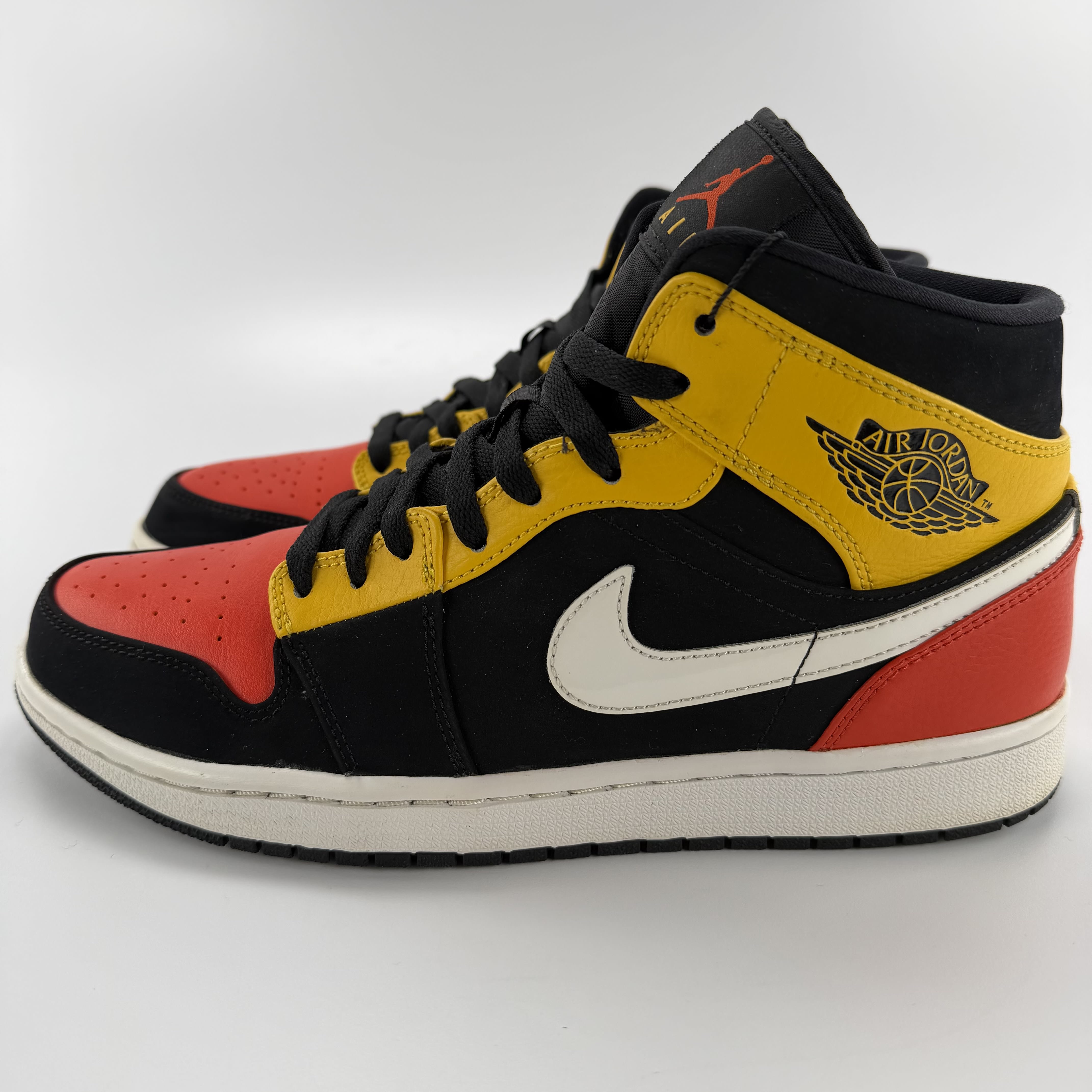 711457 Jordan 1 Mid Black Amarillo Orange