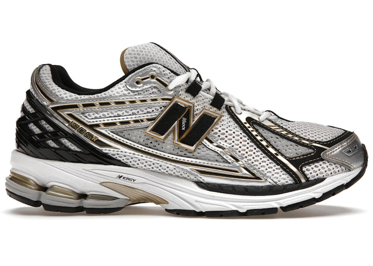 https://images.stockx.com/images/New-Balance-1906R-White-Gold-Product.jpg?fit=fill&bg=FFFFFF&w=700&h=500&fm=webp&auto=compress&q=90&dpr=2&trim=color&updated_at=1784225726