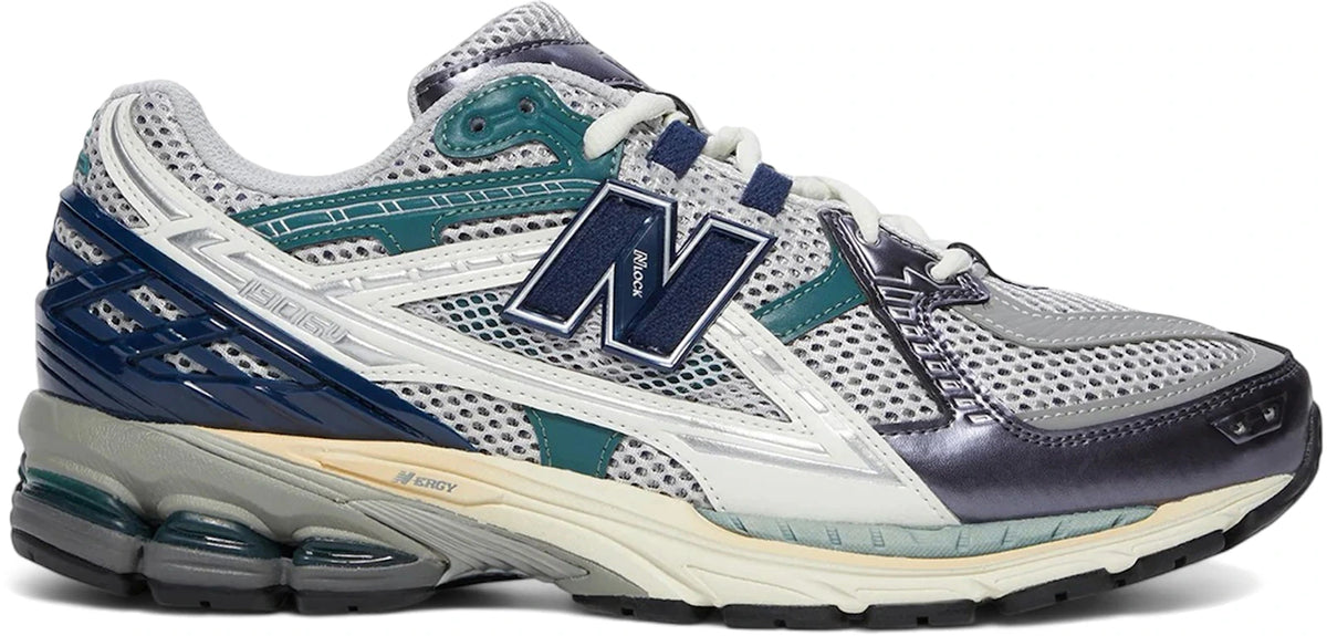 https://images.stockx.com/images/New-Balance-1906U-Navy-Grey-Matter.jpg?fit=fill&bg=FFFFFF&w=1000&fm=webp&auto=compress&q=90&dpr=2&trim=color&updated_at=1745522317