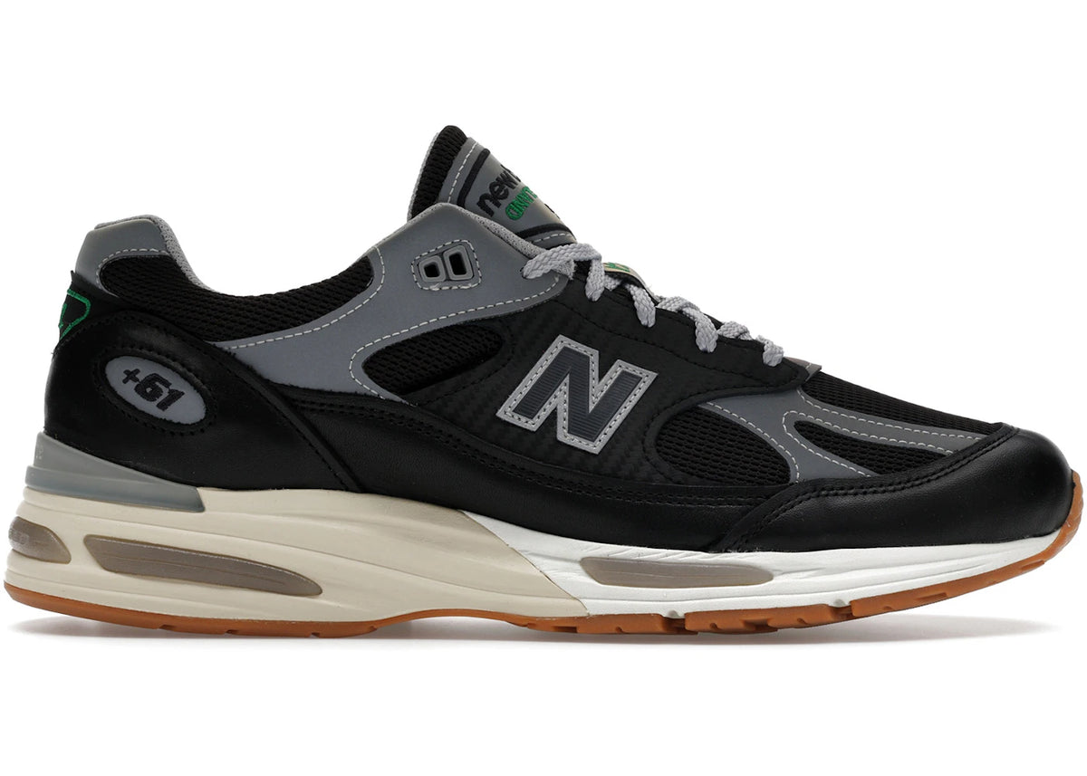 https://images.stockx.com/images/New-Balance-991v2-MiUK-Up-There-Product.jpg?fit=fill&bg=FFFFFF&w=700&h=500&fm=webp&auto=compress&q=90&dpr=2&trim=color&updated_at=1765556347