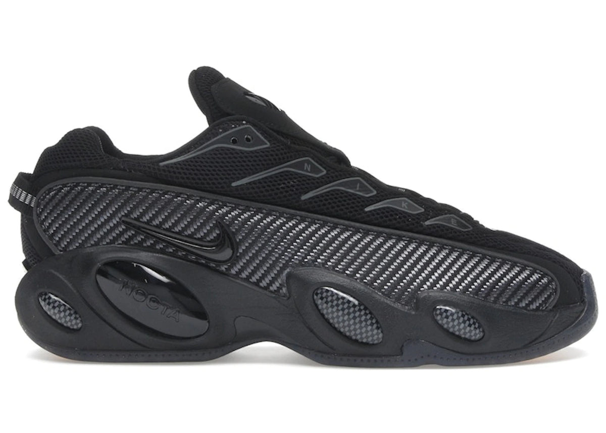 https://images.stockx.com/images/Nike-NOCTA-Glide-Drake-Black-Iron-Grey-Product.jpg?fit=fill&bg=FFFFFF&w=700&h=500&fm=webp&auto=compress&q=90&dpr=2&trim=color&updated_at=1784925075