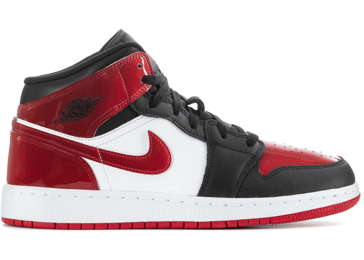 https://images.stockx.com/images/Air-Jordan-1-Mid-Patent-Bred-Toe-GS.jpg?fit=fill&bg=FFFFFF&w=700&h=500&fm=webp&auto=compress&q=90&dpr=2&trim=color&updated_at=1758119172