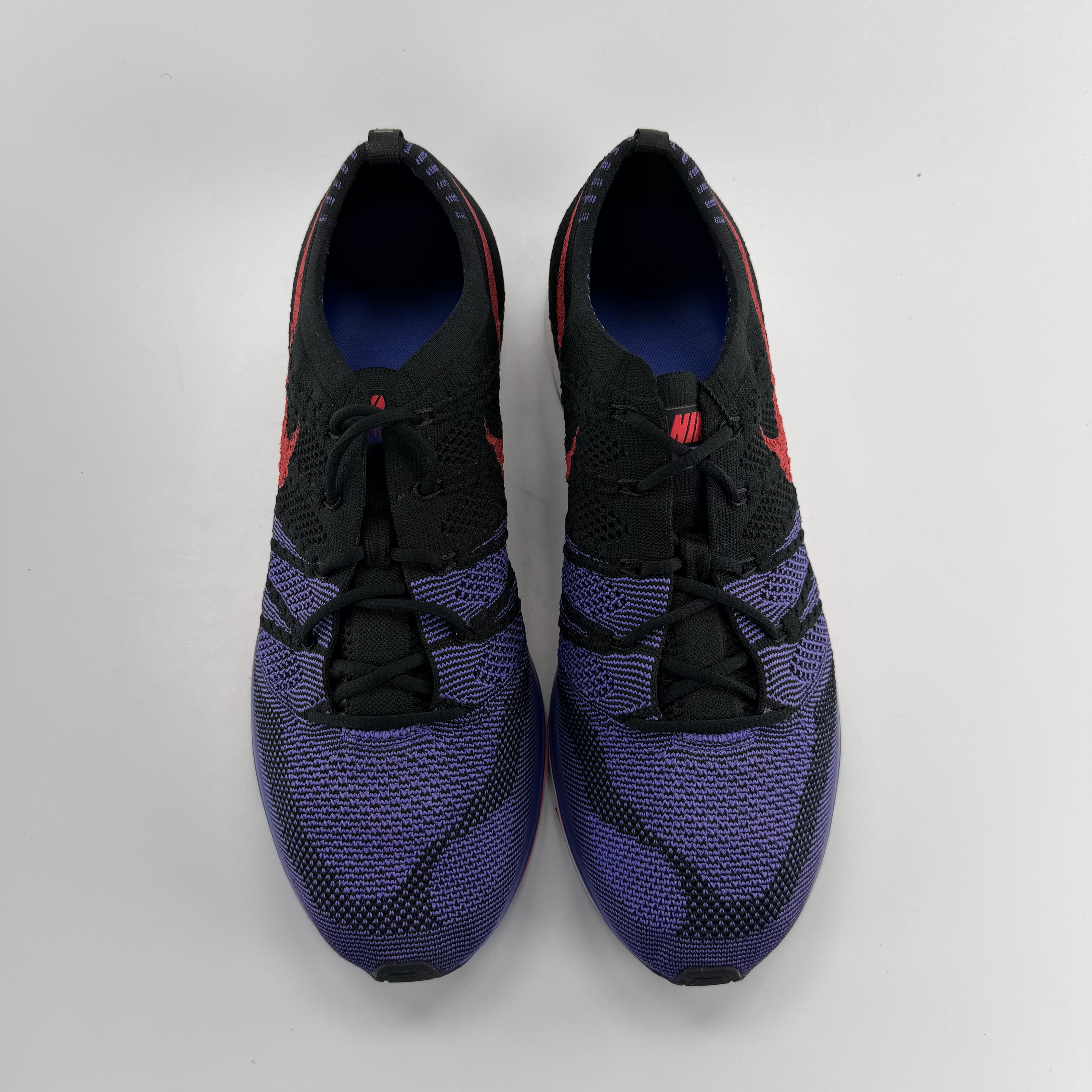 780529 Nike Flyknit Trainer Siren Red Persian Violet