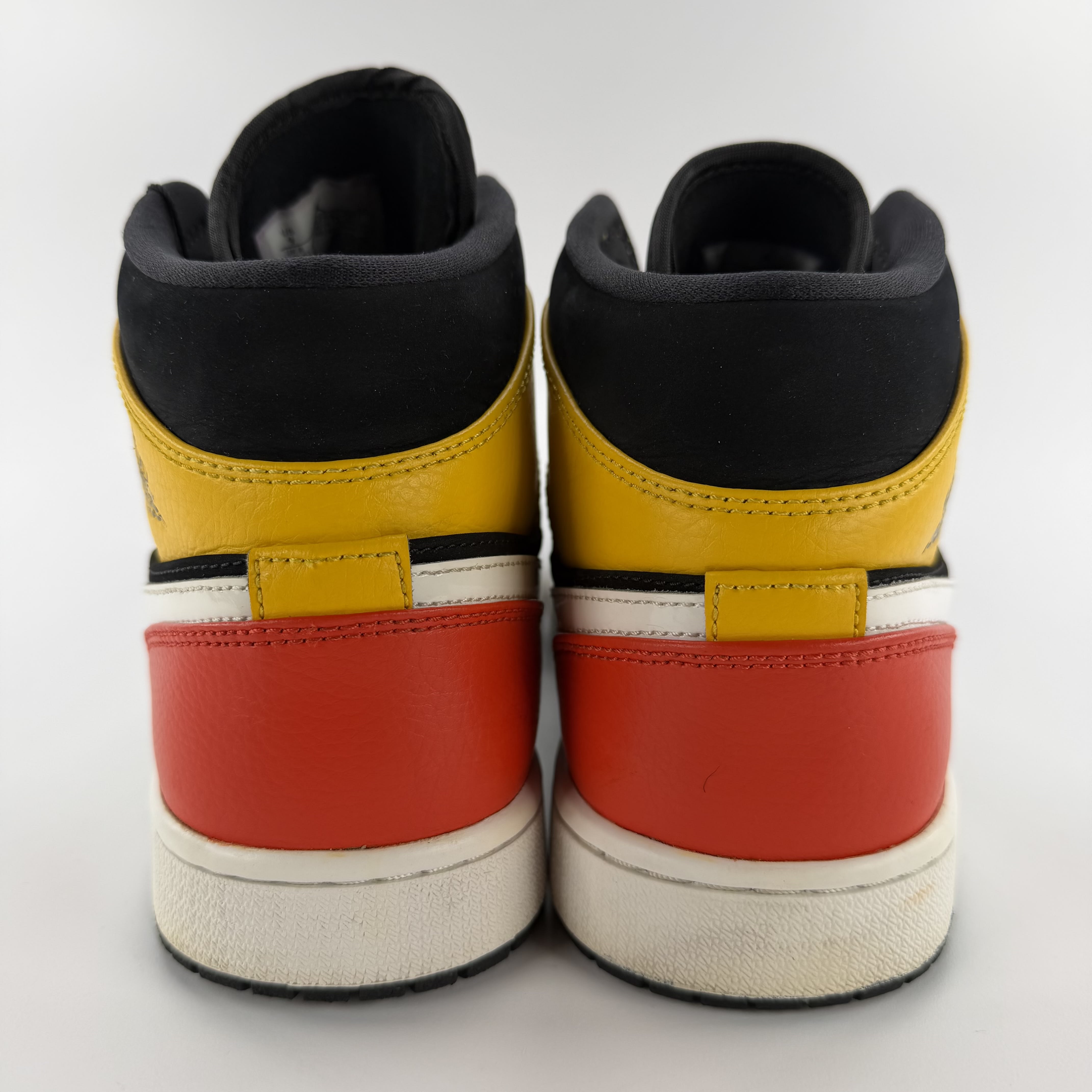 711457 Jordan 1 Mid Black Amarillo Orange