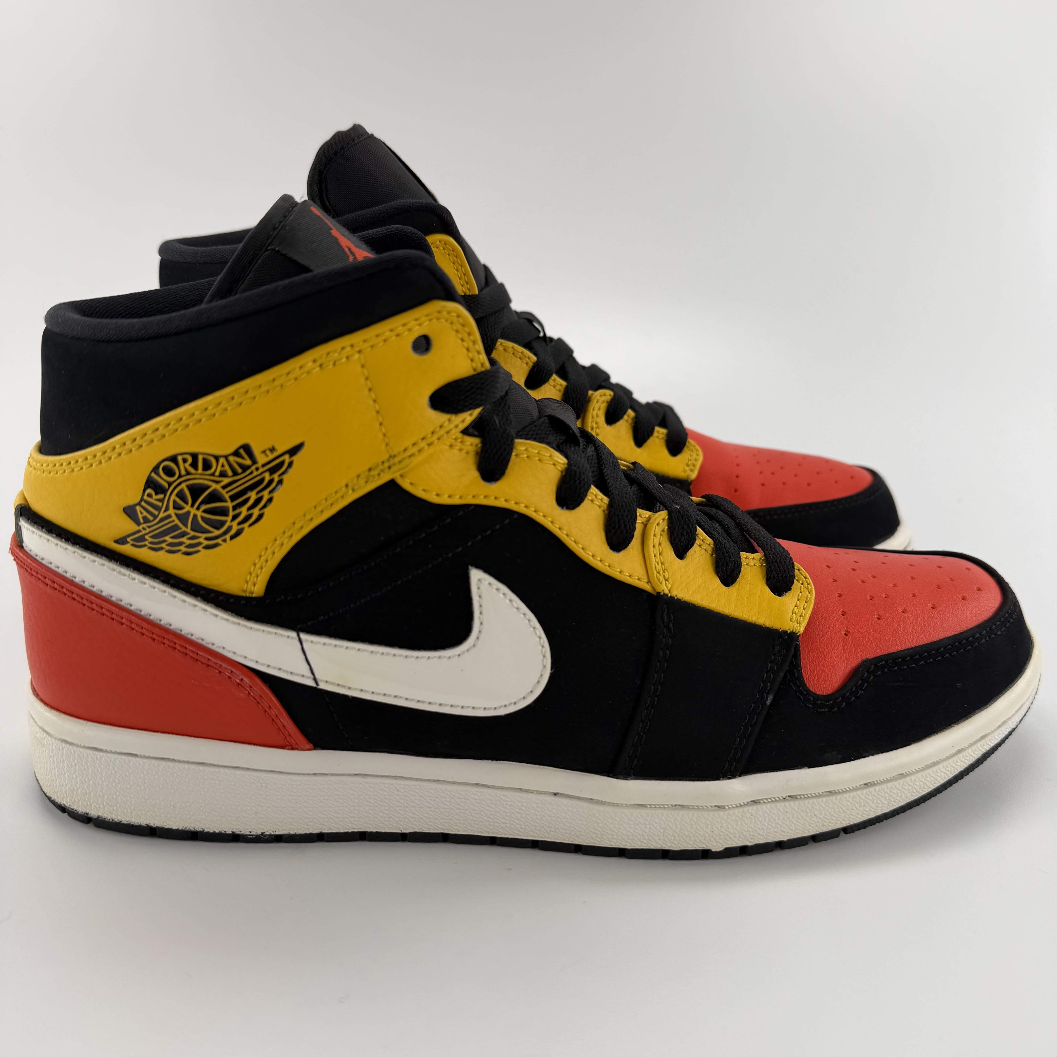 711457 Jordan 1 Mid Black Amarillo Orange