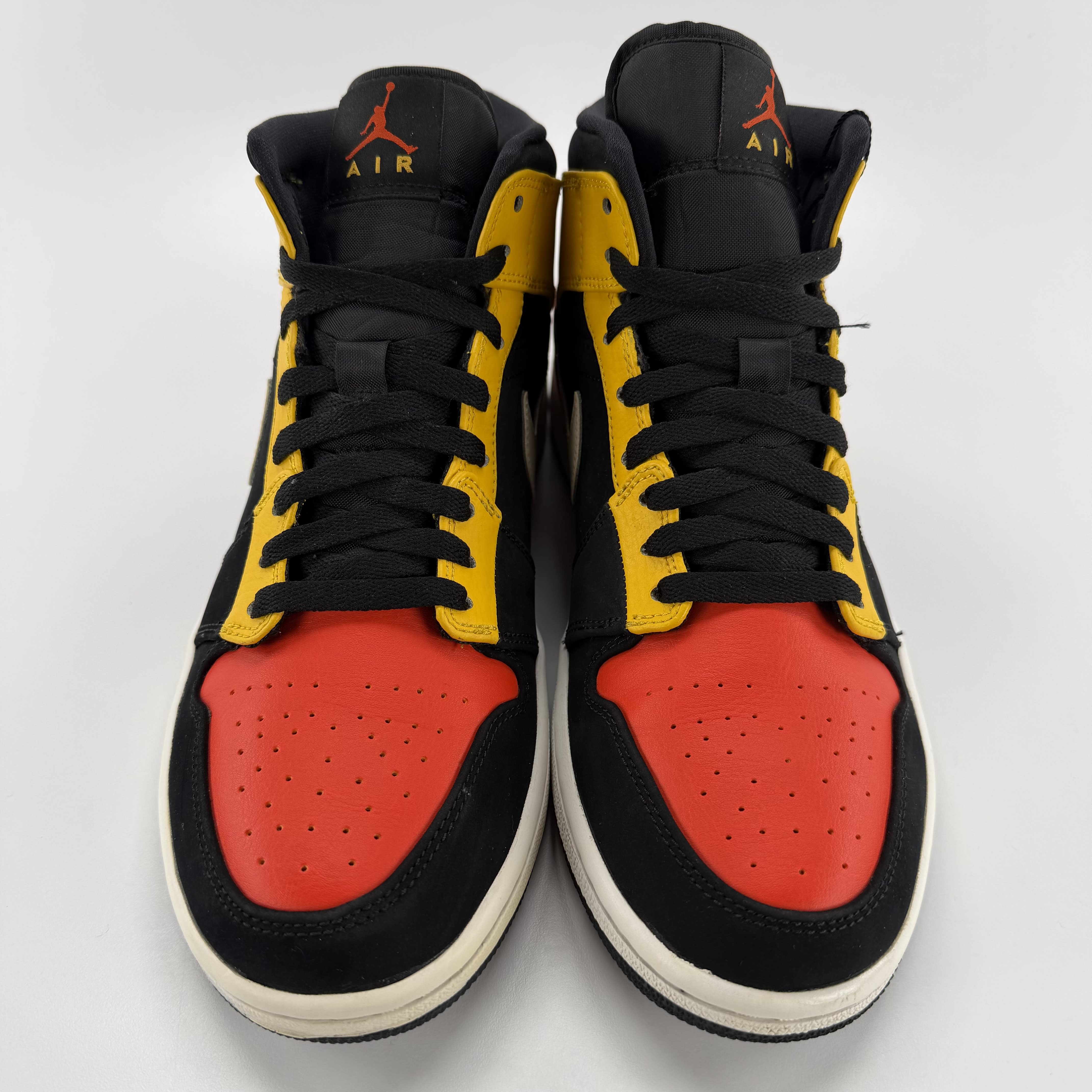 711457 Jordan 1 Mid Black Amarillo Orange