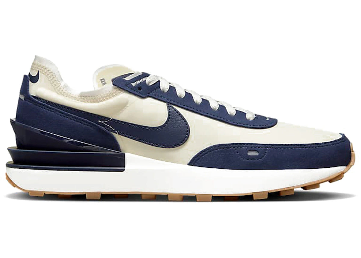 https://images.stockx.com/images/Nike-Waffle-One-SE-Coconut-Milk-Midnight-Navy.jpg?fit=fill&bg=FFFFFF&w=700&h=500&fm=webp&auto=compress&q=90&dpr=2&trim=color&updated_at=1666265122