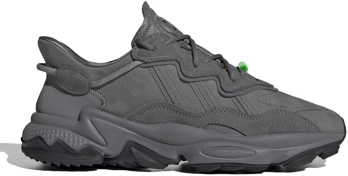 https://images.stockx.com/images/adidas-Ozweego-TR-Grey-Solar-Green.jpg?fit=fill&bg=FFFFFF&w=1000&fm=webp&auto=compress&q=90&dpr=2&trim=color&updated_at=1642460638