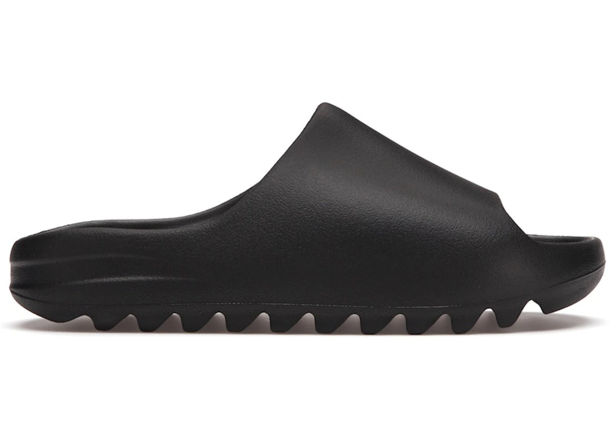 https://images.stockx.com/images/adidas-Yeezy-Slide-Black-Product.jpg?fit=fill&bg=FFFFFF&w=700&h=500&fm=webp&auto=compress&q=90&dpr=2&trim=color&updated_at=1785374852