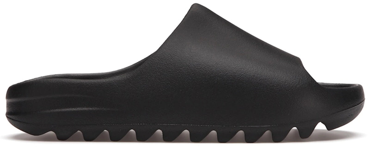 https://images.stockx.com/images/adidas-Yeezy-Slide-Black-Product.jpg?fit=fill&bg=FFFFFF&w=1000&fm=webp&auto=compress&q=90&dpr=2&trim=color&updated_at=1785374852