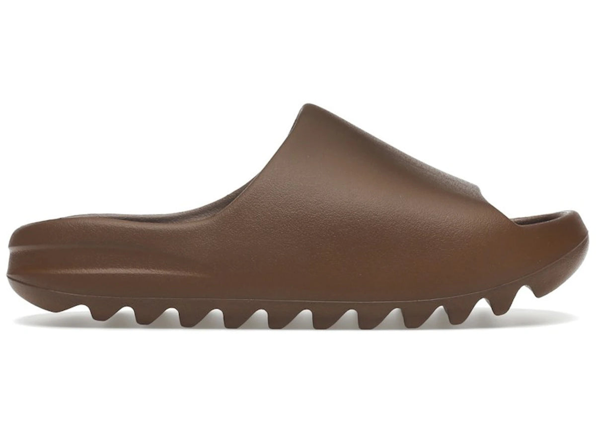 https://images.stockx.com/images/adidas-Yeezy-Slide-Flax-Product.jpg?fit=fill&bg=FFFFFF&w=700&h=500&fm=webp&auto=compress&q=90&dpr=2&trim=color&updated_at=1738193358