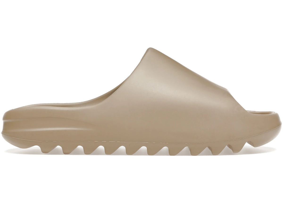 https://images.stockx.com/images/adidas-Yeezy-Slide-Pure-Product.jpg?fit=fill&bg=FFFFFF&w=700&h=500&fm=webp&auto=compress&q=90&dpr=2&trim=color&updated_at=1738193358